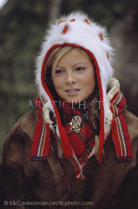 Portrait of pretty Sami girl in a traditional hat and peske at the Jokkmokk Winter Market. Sweden